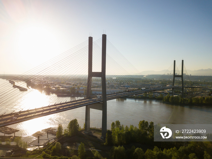 Aerial view of Alex Fraser Bridge during a vibrant sunny day. Taken in North Delta, Greater Vancouver, BC, Canada.