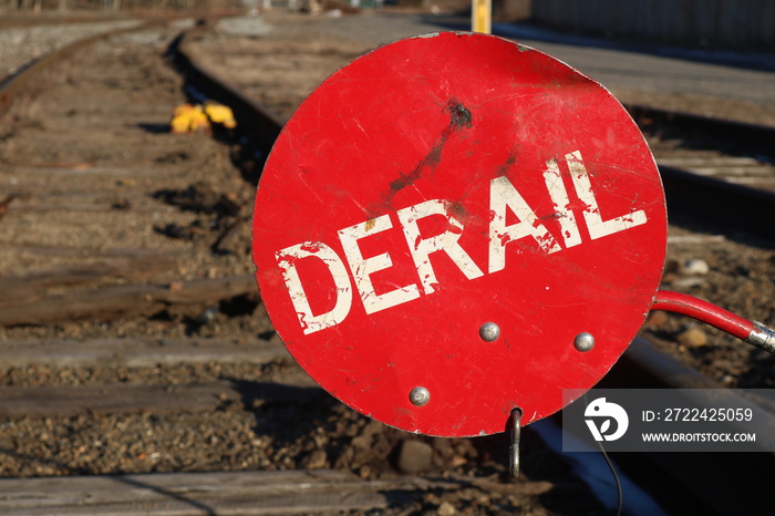 Red derail symbol sign on old abandoned railroad tracks