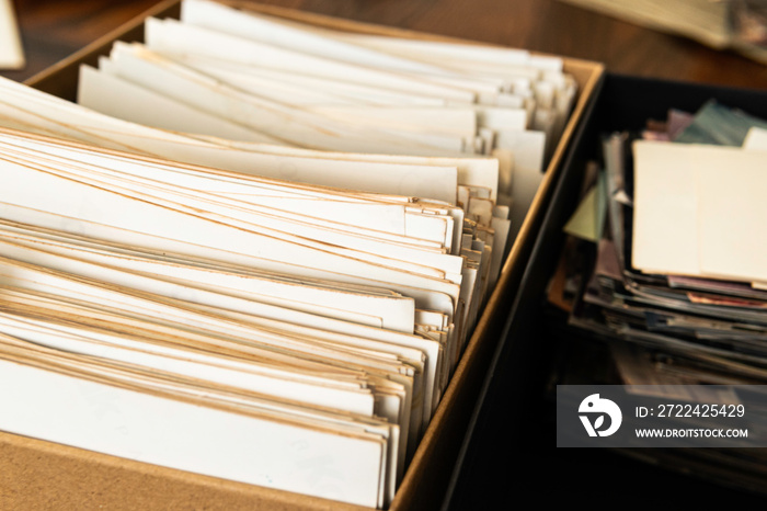 Stack of old photo prints and Memories to be digitized a