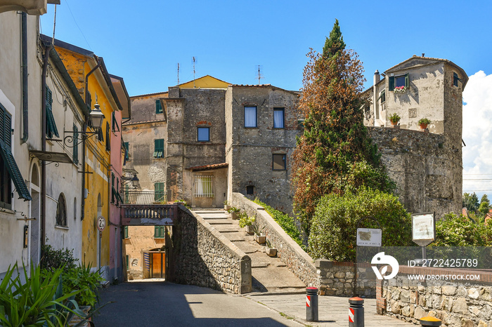 View of the old town with the city walls and the Torrione of Saint Francis, ancient defensive buildings of Sarzana, La Spezia, Liguria, Italy