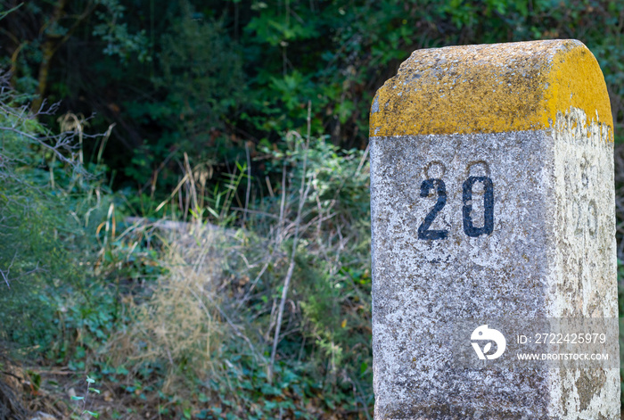 Old milestones exposed on the Bailen-Motril road (N-323) as it passes through La Cerradura de Pegalajar (Jaen-Spain)