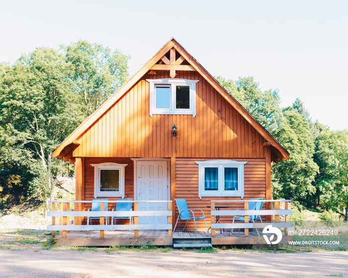 Small wooden cottage in the Norwegian style with a terrace