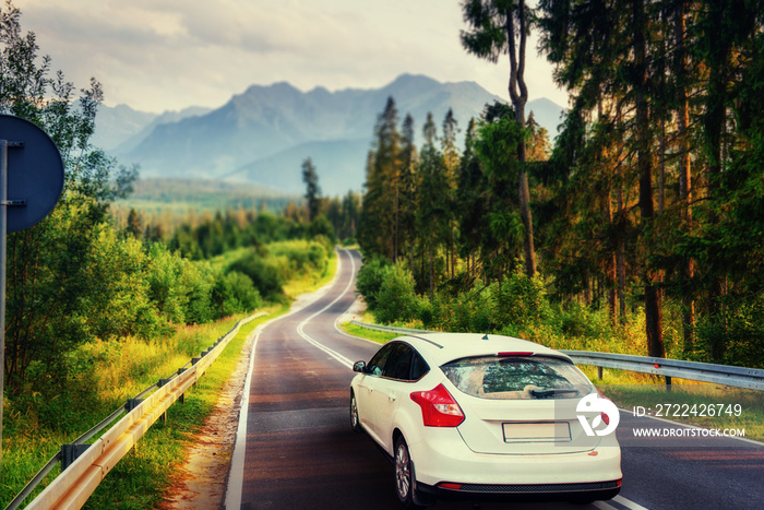 The car on asphalt road in the mountains. Carpathian. Ukraine