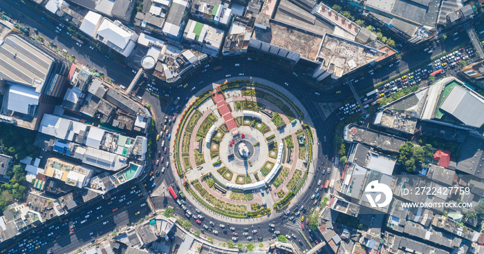 Circular junction road with modern building green city park