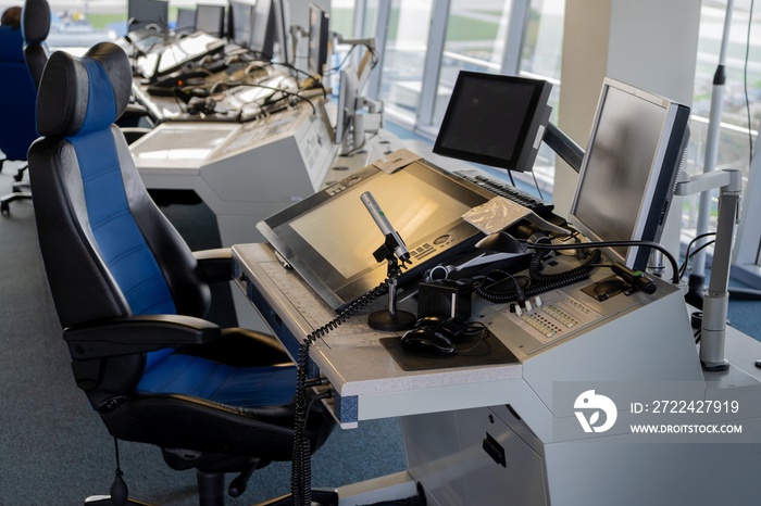 The workplace of the flight dispatcher in the airport. Flight control tower. Aviation background. Air Traffic Manager. Armchair and remote control with screen. Air Traffic Controller room.