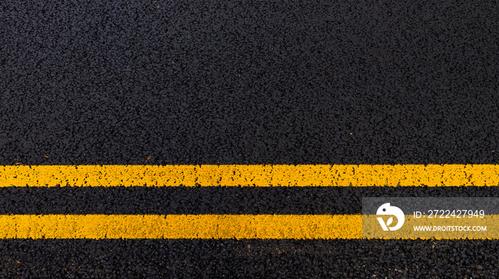 Asphalt background with yellow lines