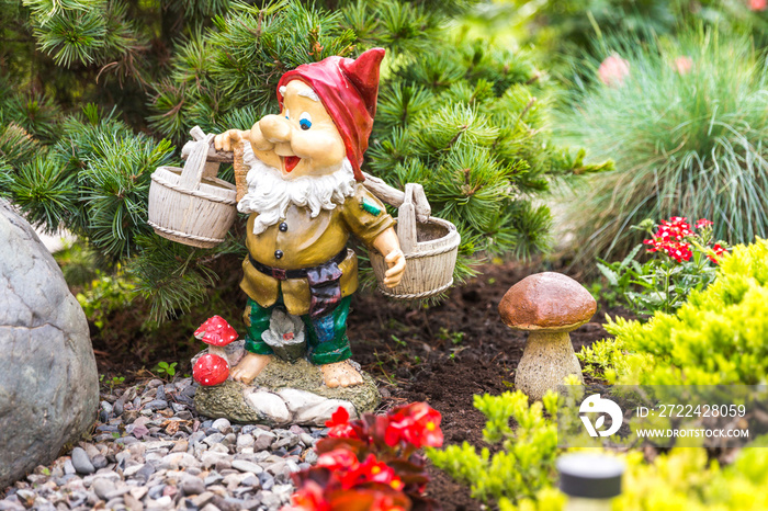 garden dwarf in home garden, gnome decoration