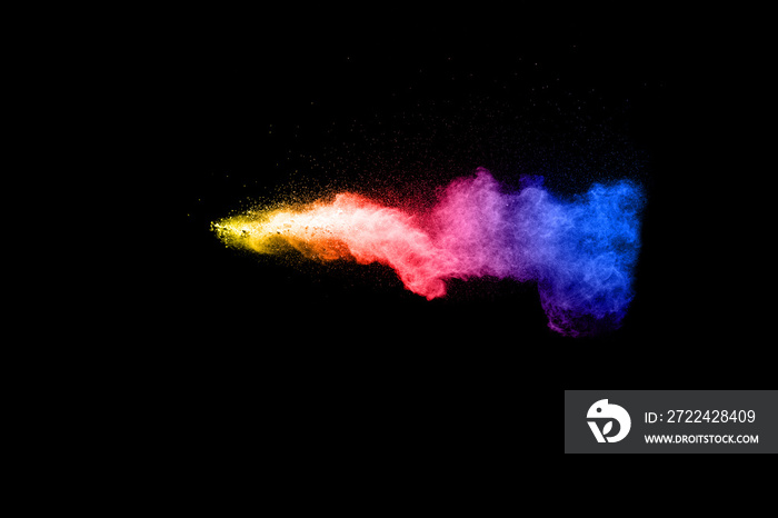 Abstract multicolored powder splatter on black background,Freeze motion of color powder splash. Color dust explosion on background.