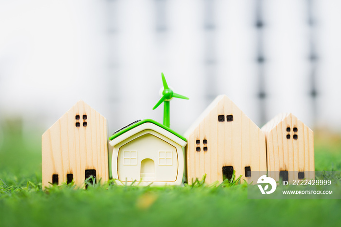 Wind turbine house model with a simple wooden house model clean energy concept