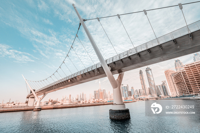 Dubai water canal footbridge as a masterpiece of engineering and design thought. UAE landmarks and destinations