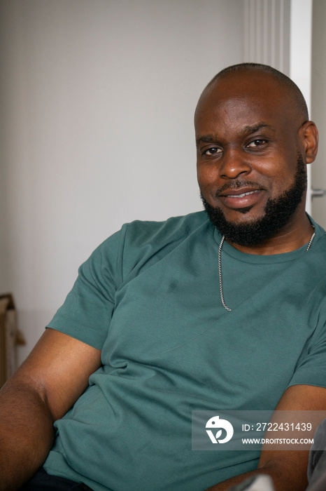 Portrait of smiling man in green t-shirt