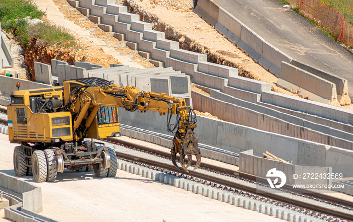 Backhoe and improvement construction of railway