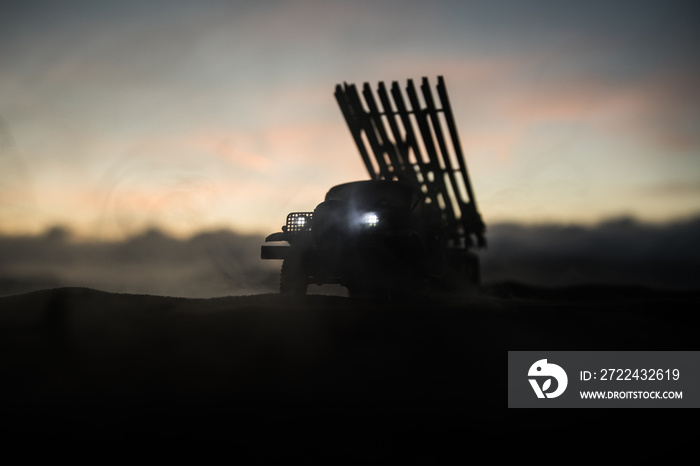 Battle scene with rocket Missiles with Warhead Aimed at Gloomy Sky at night. Soviet rocket launcher on War Background. Creative composition.