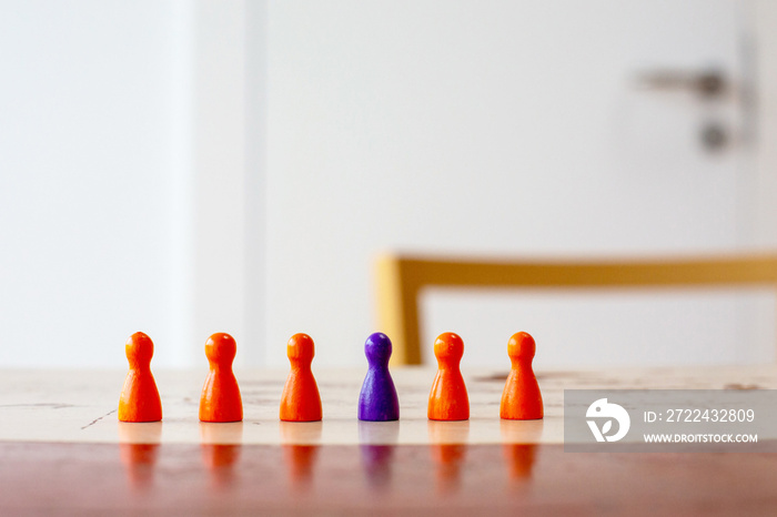 close-up of game pieces on a table in a row