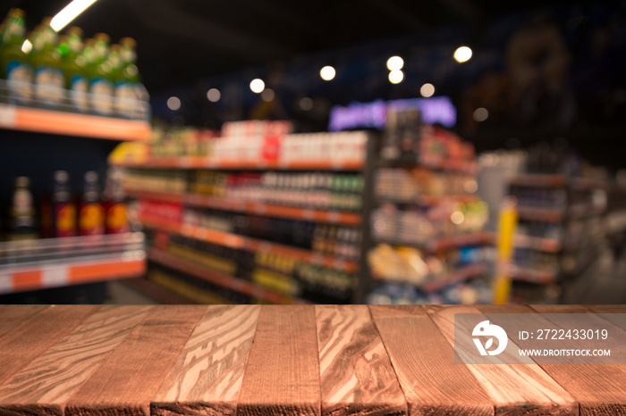 Wood top table on blur supermarket background