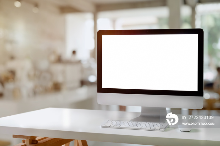 Mockup desktop blank screen computer on white wood table.