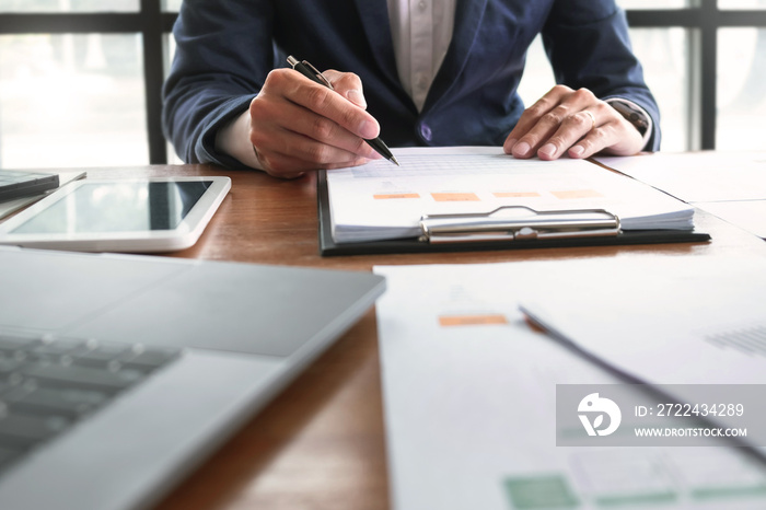 Accountant working with data documents calculating on business report, Selective focus.