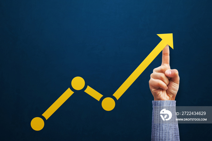 Businessman is touching arrows pointing up with graph as a symbol of growth and success or rising successful development and business development in the future