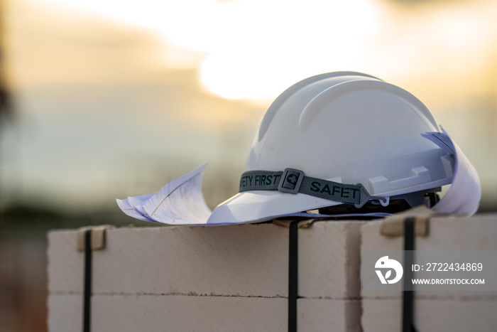 White and Yellow helmet hard hat safety in site construction,concept safety first.