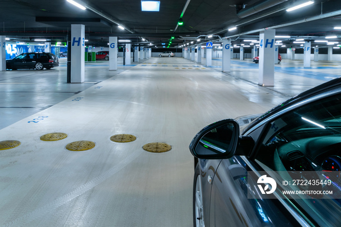 Parking lot. Car lot parking space in underground city garage. Empty road asphalt background. Ground floor for car parking.