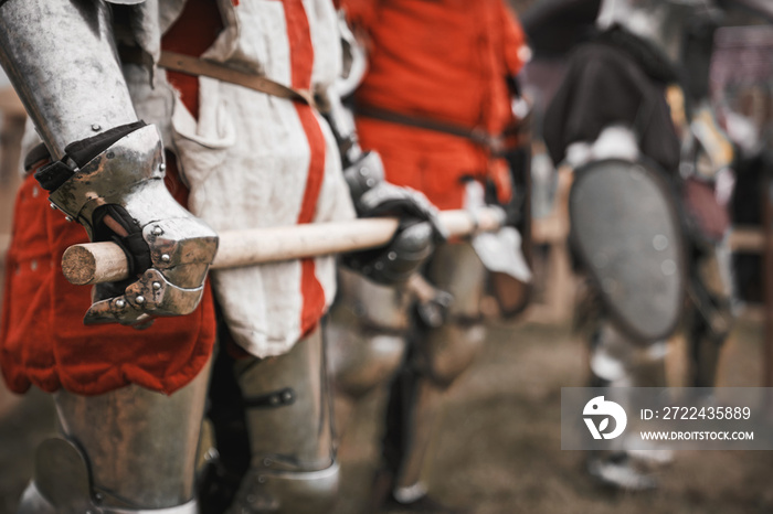 Sword in medieval knight arms.