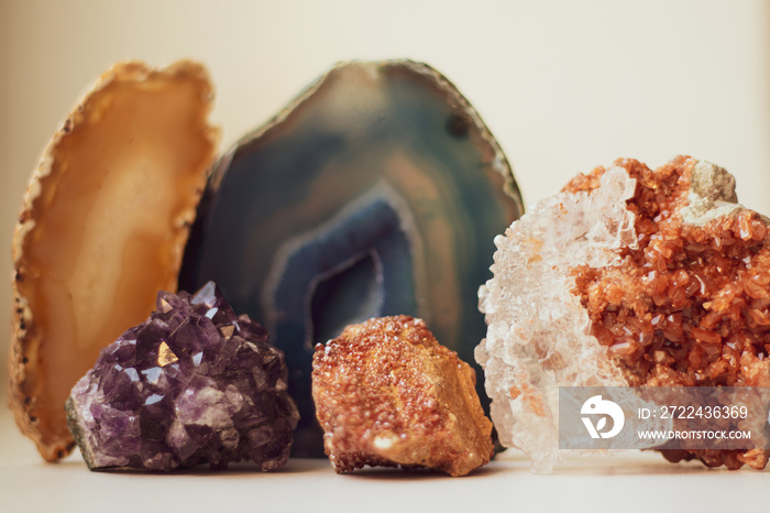 Large blue crystal of agate and druse crystals, cross section isolated on white background. Natural translucent crystal agate surface, collection stones