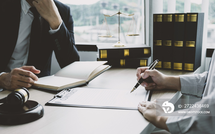 Businessman hand sign contract after lawyer providing legal consult dispute