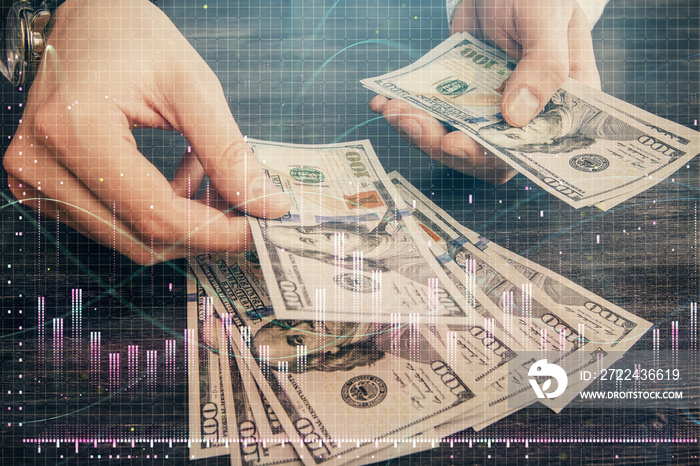 Multi exposure of financial graph drawing hologram and USA dollars bills and man hands. Analysis concept.