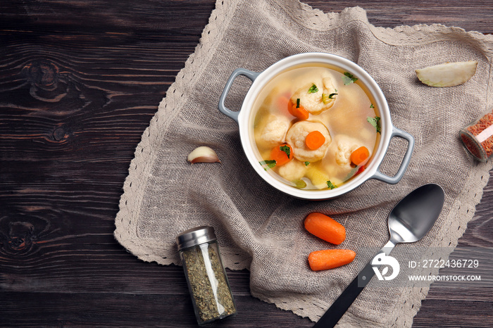 Ceramic pan with delicious chicken and dumplings on decorative napkin