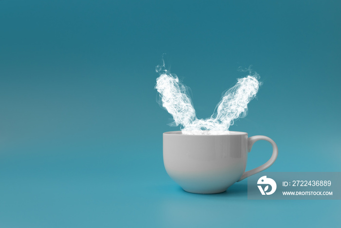 Steam in rabbit ears shape from coffee cup. Morning drink. Easter celebration concept. Copy space.