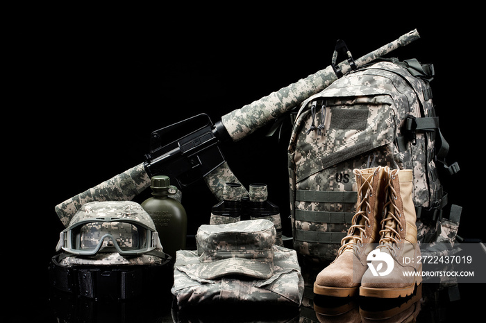 Military supplies on black background.