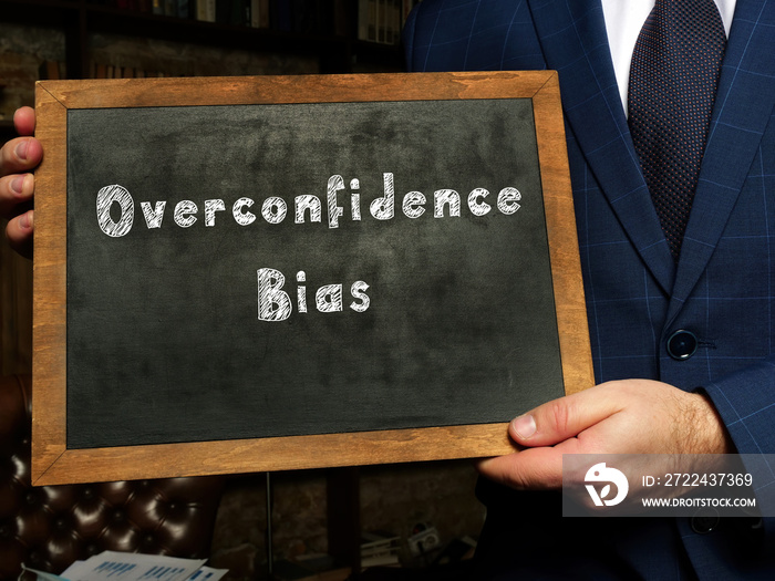 Business concept about Overconfidence Bias with phrase on the black chalkboard.