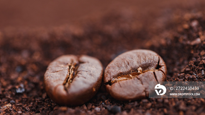 Coffee beans on ground coffee background