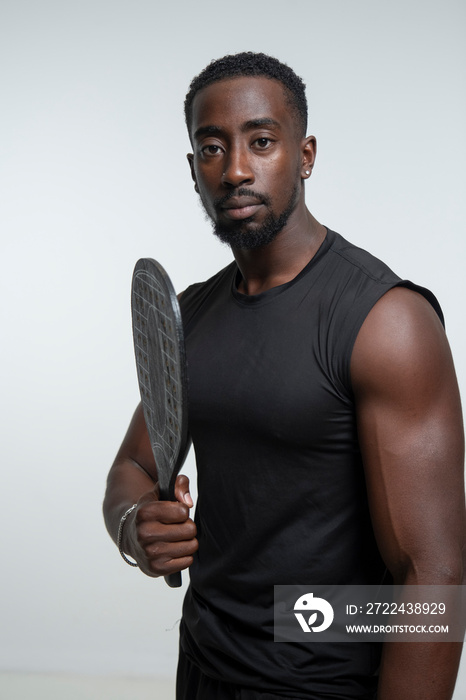 Portrait of man holding pickleball racket