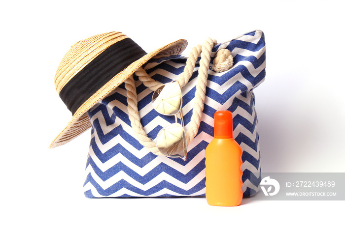 beach bag and hat isolated on white