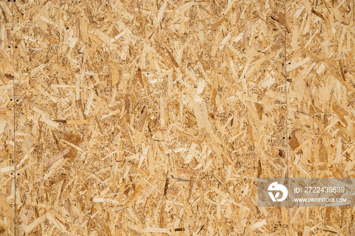 Pressed sawdust background, wooden shaving colorful texture