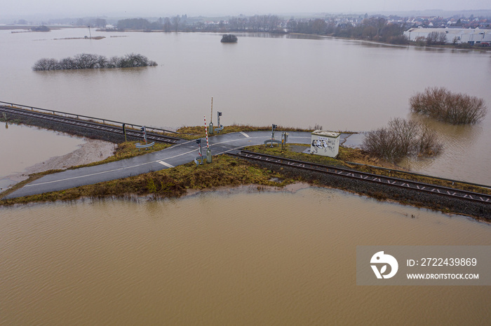 Flooded road passing through the railway. A road under water