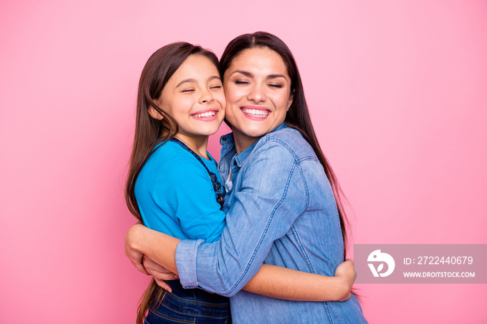 Portrait of two nice cute pretty trendy stylish lovely attractive charming tender cheerful positive girls hugging care trust feelings new family life closed eyes isolated over pink pastel background