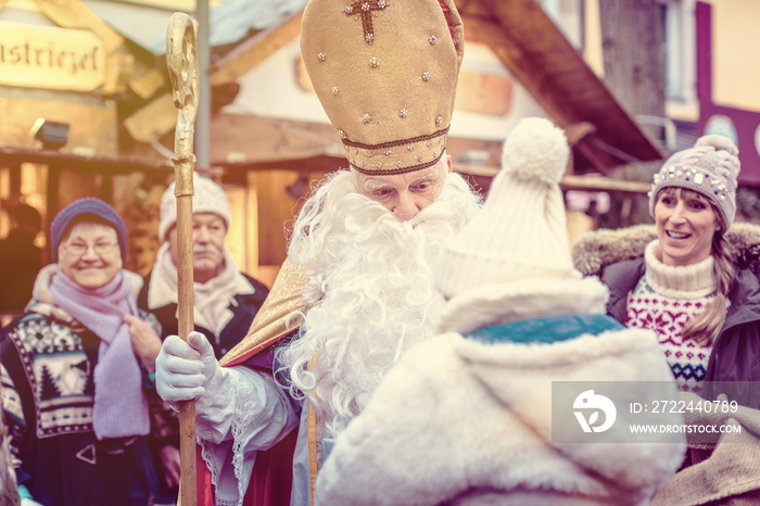 St Nikolaus and an extended family on the Christmas market