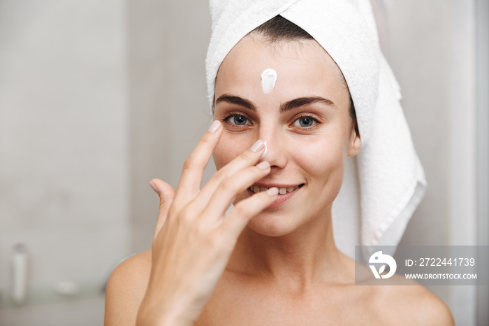 Close up of a beautiful young woman with towel