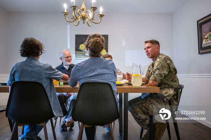 Air Force service member fixes and eats dinner with family.