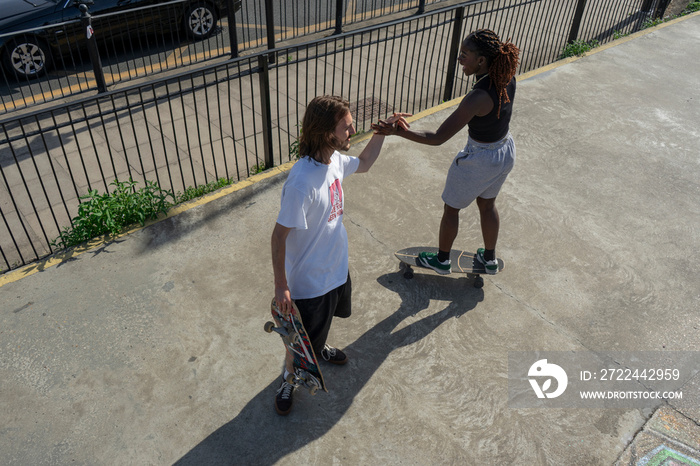 Young people skateboarding in skate park