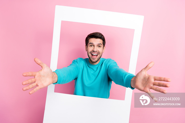 Photo portrait of attractive young man polaroid instant photo frame ready hug dressed stylish blue outfit isolated on pink color background