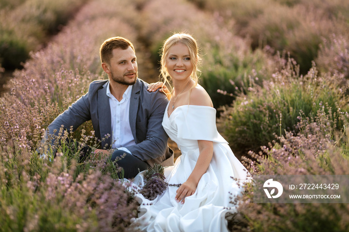 bride and groom on in the lavender field