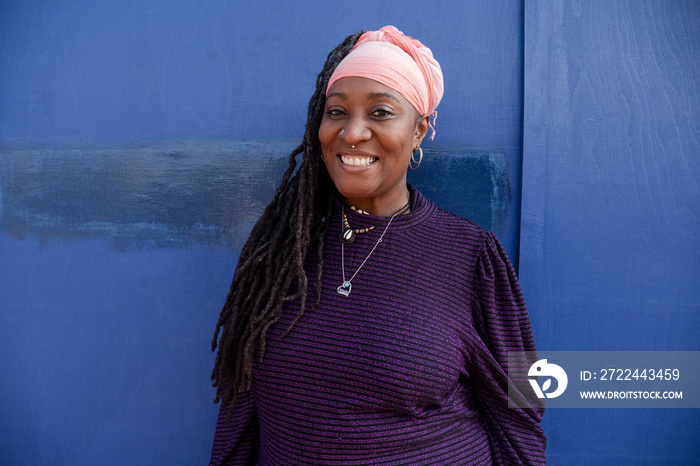 Portrait of beautiful woman with dreadlocks wearing turban