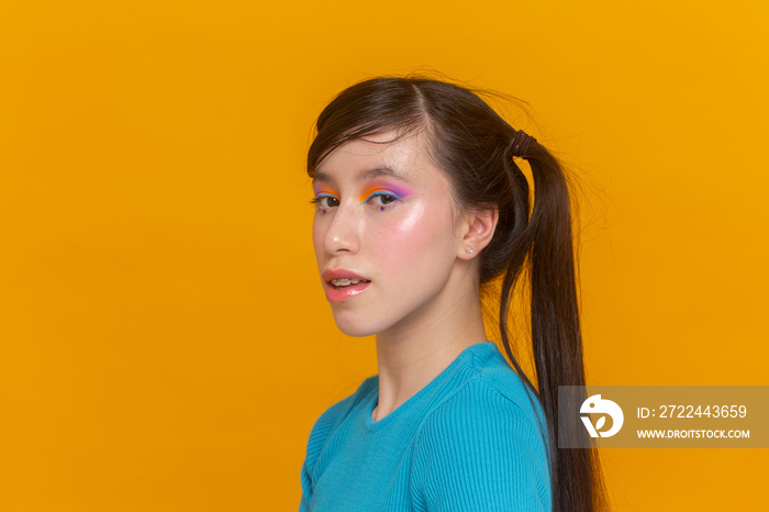 Studio portrait of girl with colorful make-up