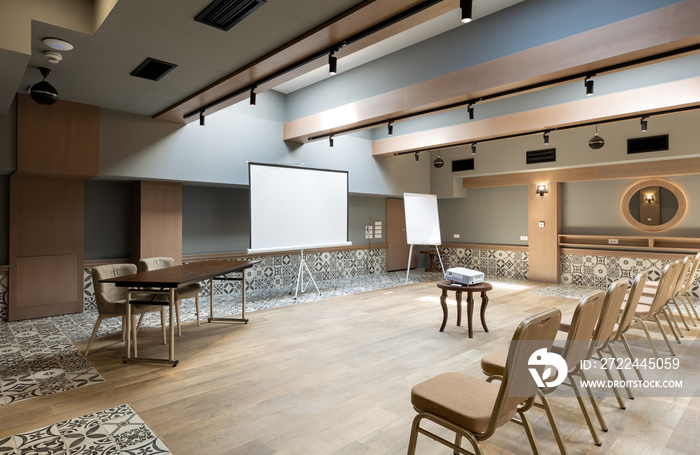 Interior of a empty hotel seminar room with chairs in a row