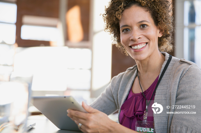 Portrait of businesswoman with tablet computer.