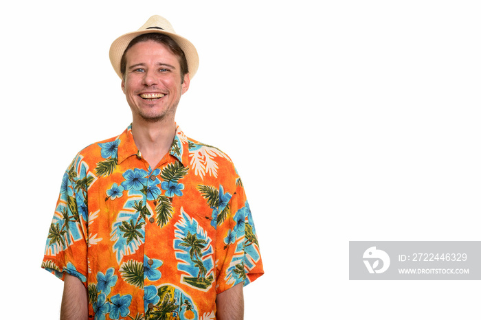 Happy Caucasian man ready for vacation looking at camera