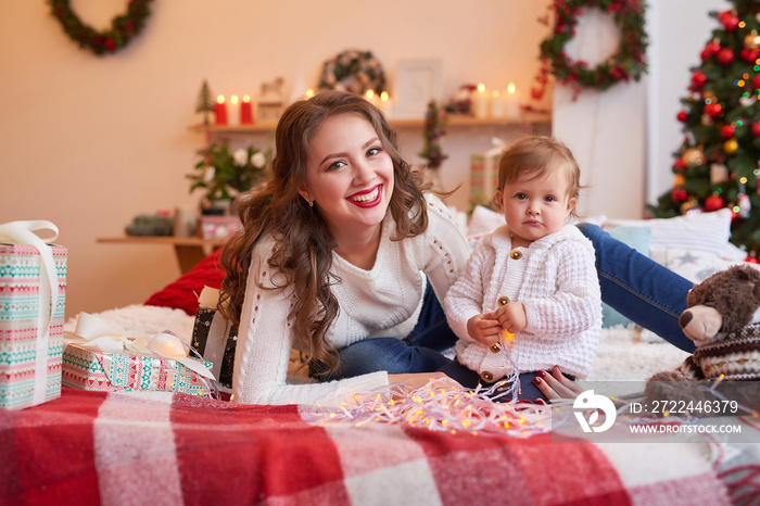 Christmas family Mom and daughter. Merry Christmas and Happy Holidays card! Morning before Xmas background. Portrait loving family. Family preparation holiday food. Happy New Year! Christmas baby